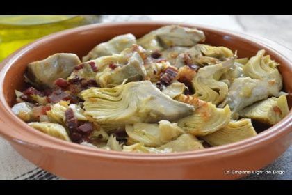 Receta de alcachofas con guisantes y jamón